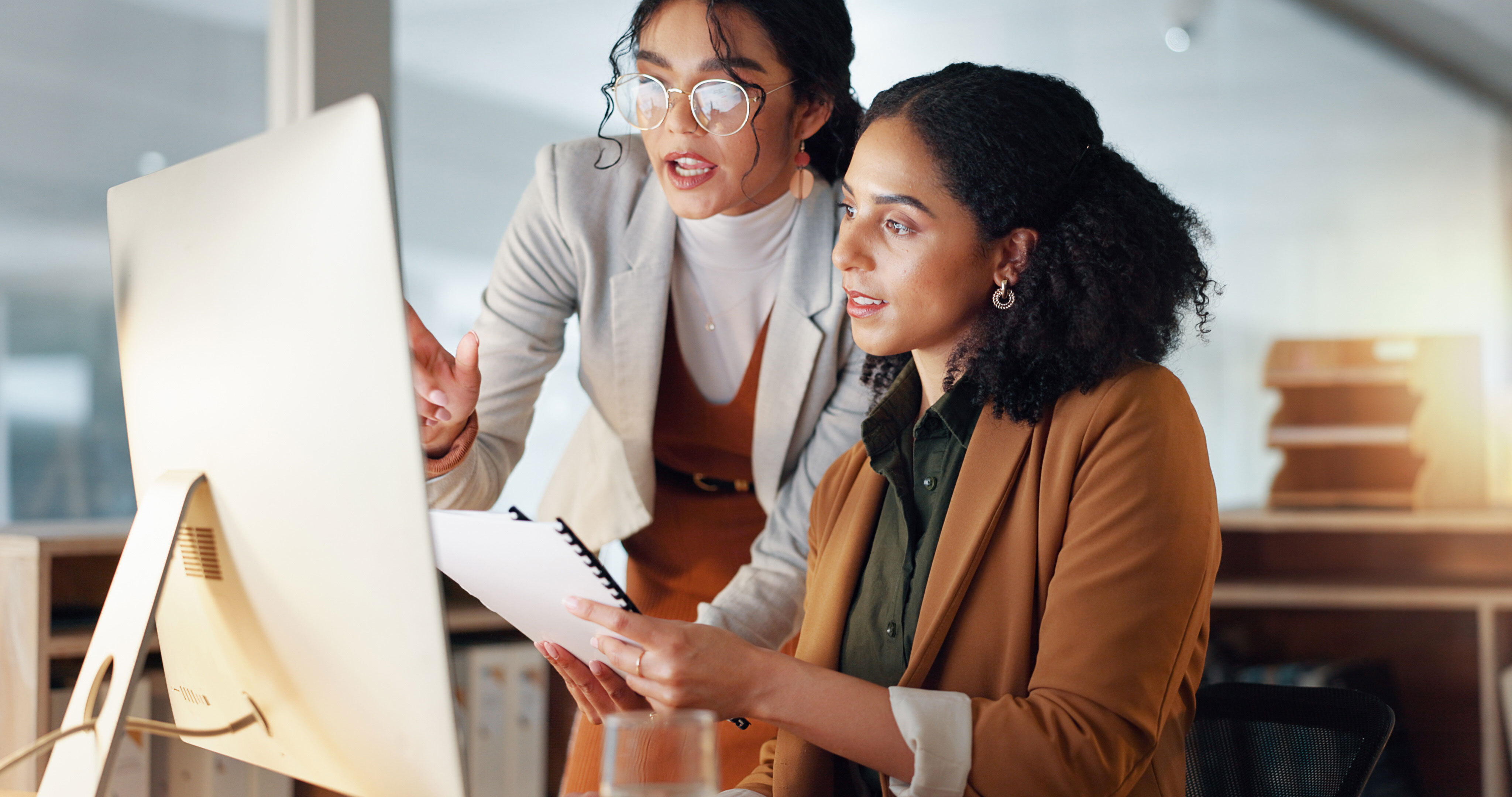 People collaborating at a computer